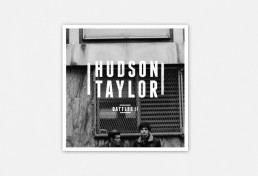 Graphic design and photography services showcasing a black and white album cover design with a white logo