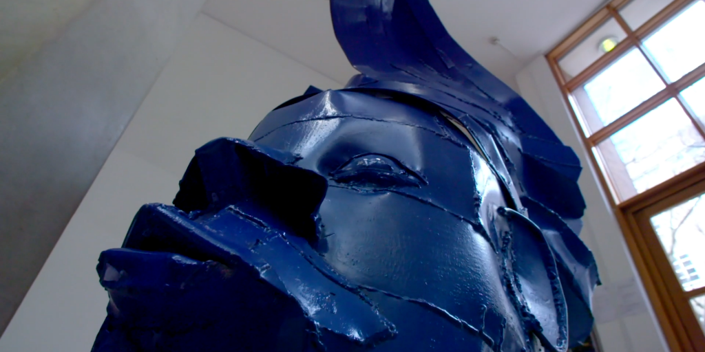 African Inspired Blue Sculpture In Museum Entrance Of University