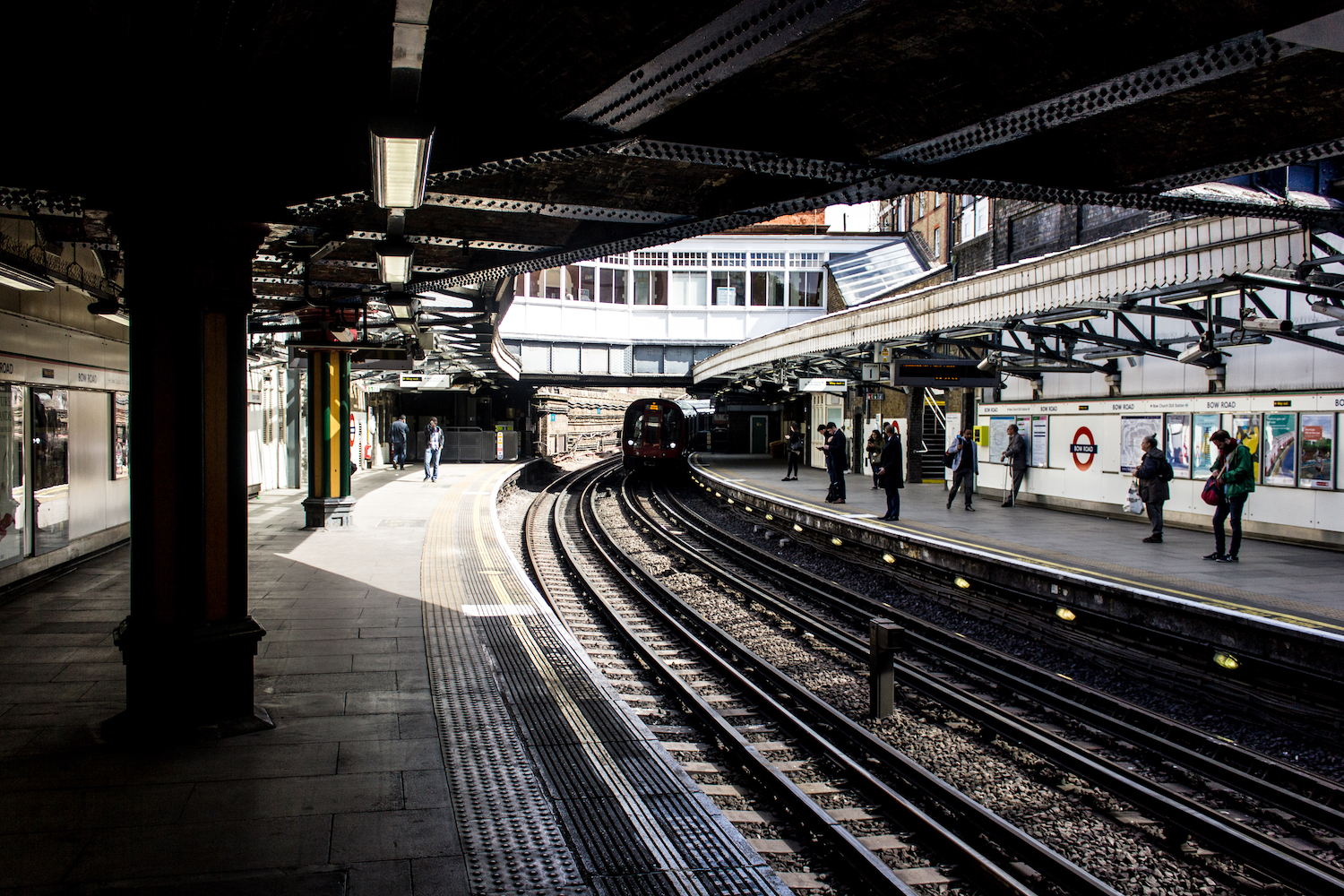 Professional Photography People Waiting On Train Platform As Train Approaches In Bow Train Station London