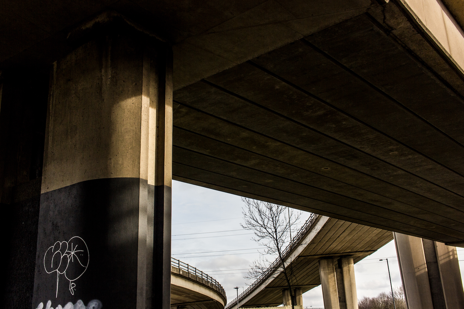 Professional Photography Concrete Roundabout In South Woodford North East London With Three Overpasses Graffiti And Pillars