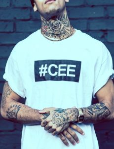 Streetwear fashion shoot and film production featuring a professional photography close-up portrait against a black brick wall.