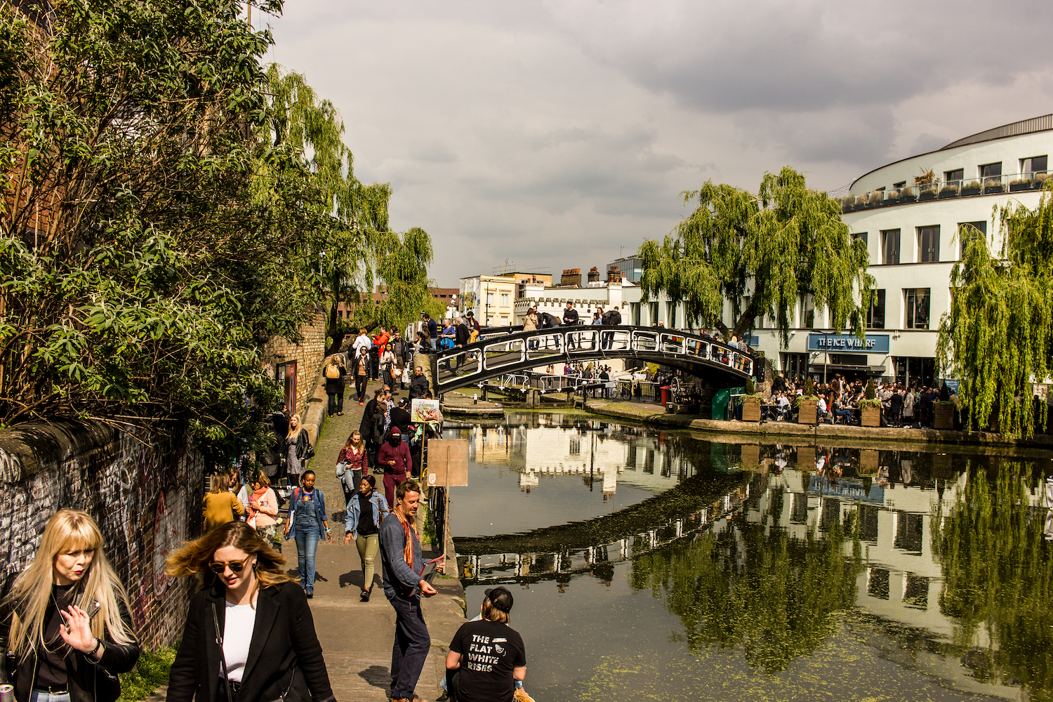 Professional Photography Landscape Of Camden Town Canal Riverside With People Walking Green Trees And Buildings