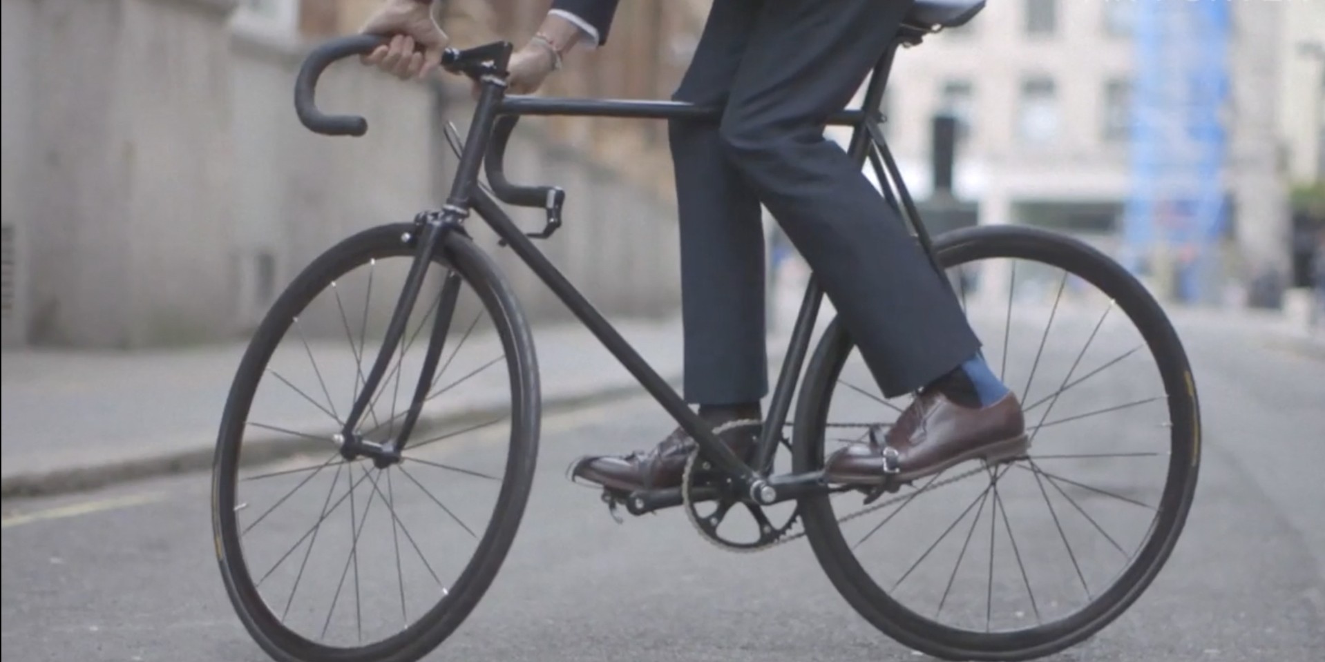 Fashion Designer In Blue Suit And Brown Leather Shoes Riding Custom Carbon Racing Bike On London City Street