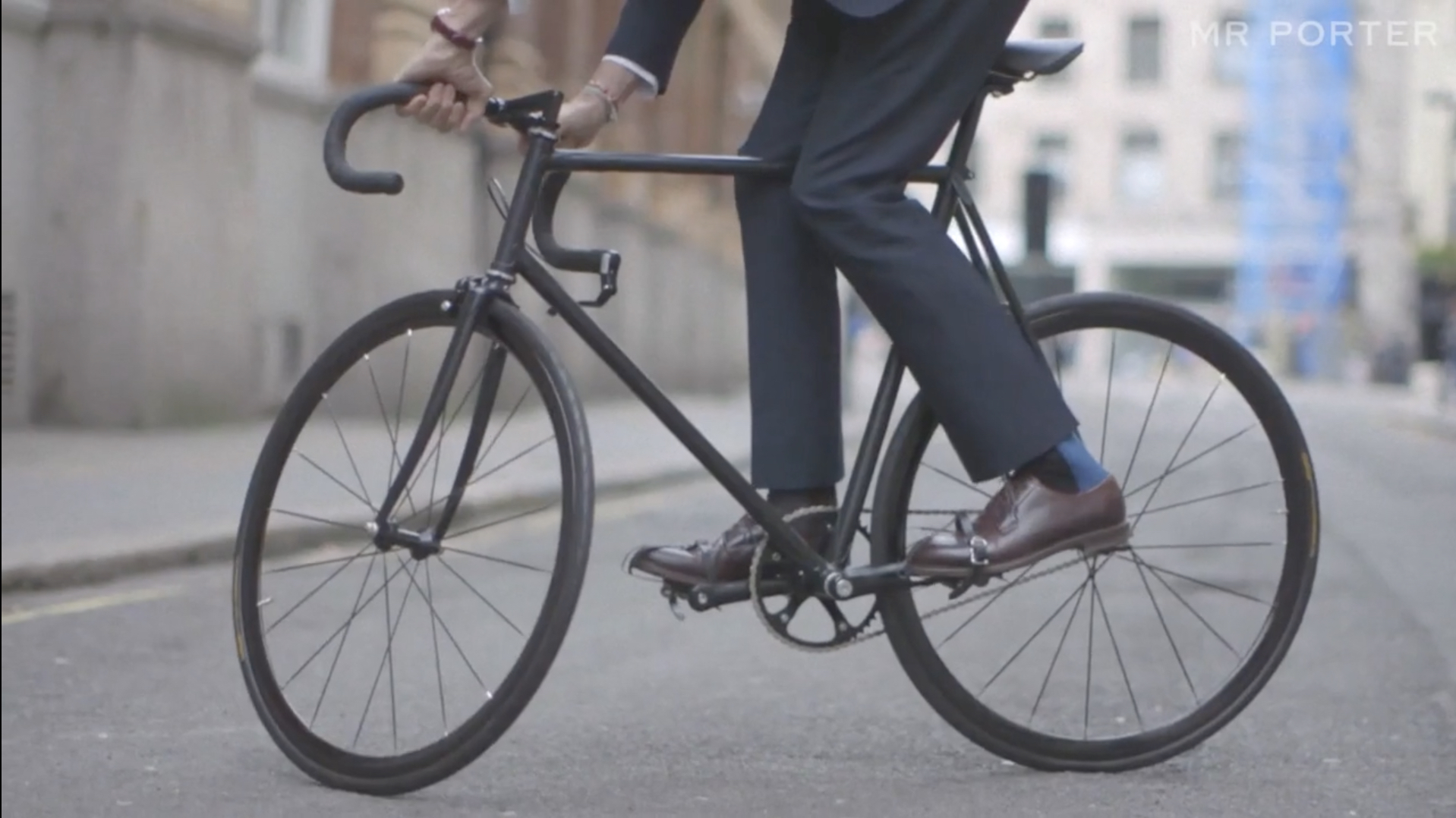 Fashion Designer In Blue Suit And Brown Leather Shoes Riding Custom Carbon Racing Bike On London City Street